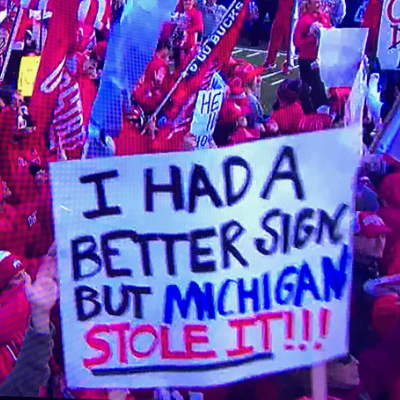 A screen capture from Fox Sports' Big Noon Kickoff. The sign reads, "I had a better sign but Michigan stole it!" | BobMuellerWriter.com - Unmasking the Wolverines: Did Michigan Really Steal Signs or Simply Scout Smartly?