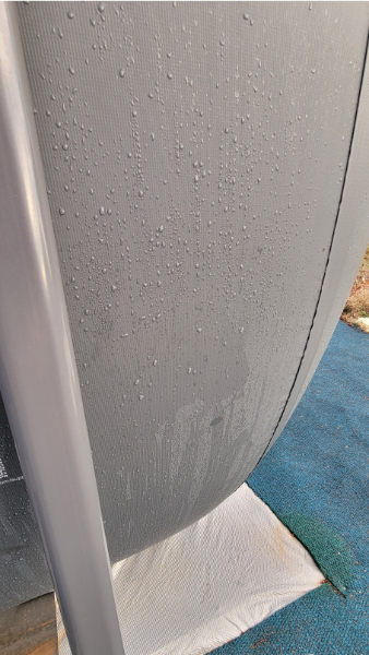 Image is of condensation on the side of an above-ground pool | Censuses, Carpenters, and the Myth of the Lonely Manger